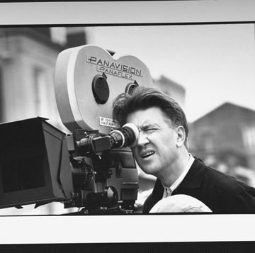 director david lynch with his eye closed and looking into a film camera