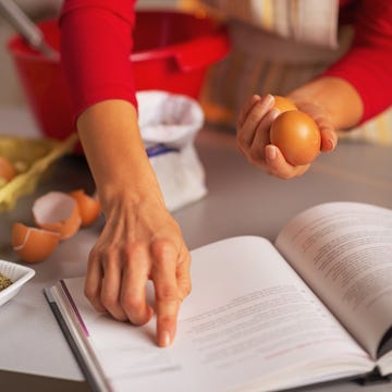 closeup on happy housewife preparing christmas dinner in kitchen