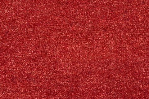 A closeup picture of a clean and bright red carpet