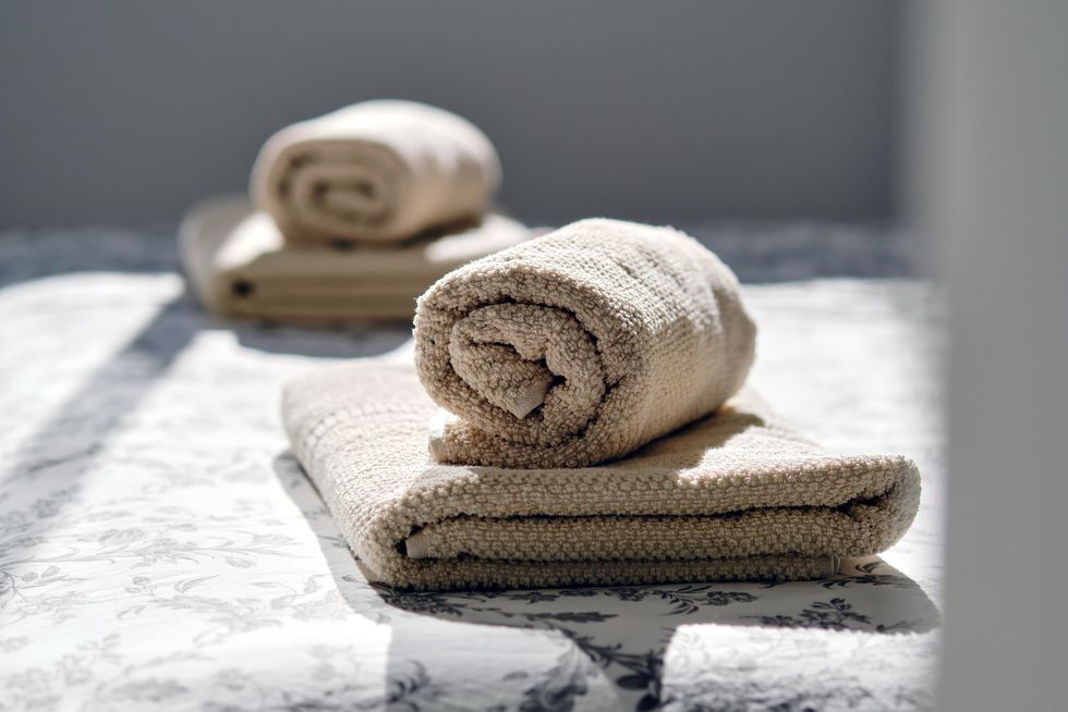 closeup two fresh clean folded rolled towels
