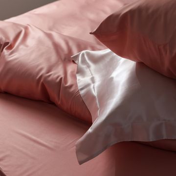closeup view of bed with beautiful silk linens