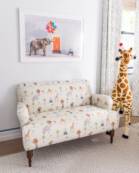 Giraffe, Furniture, Room, Living room, Couch, Giraffidae, Slipcover, Interior design, Chair, Wallpaper, 