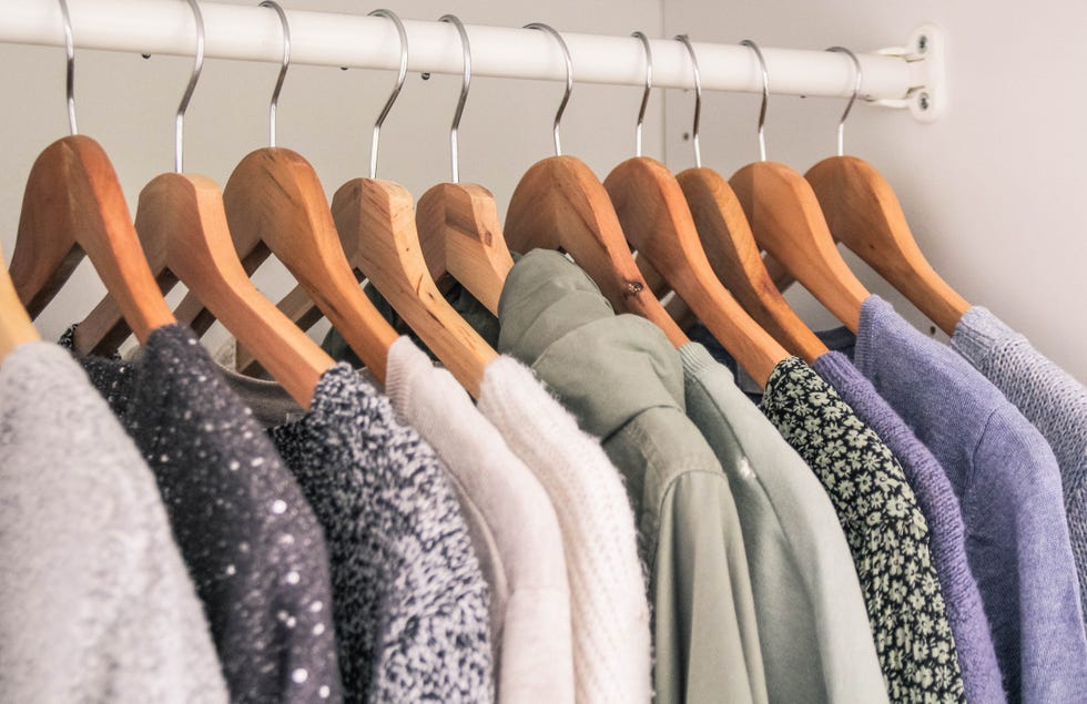 clothes hanging in the wardrobe