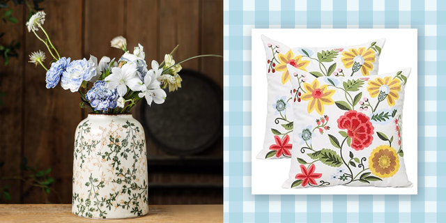 a vase filled with flowers and floral pillows