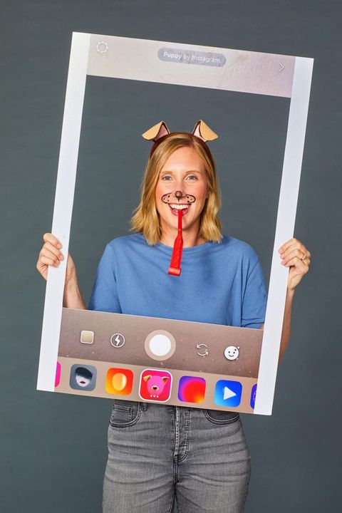 mom halloween costume with dog ears headband, dog makeup, red party horn "tongue" and instagram poster frame