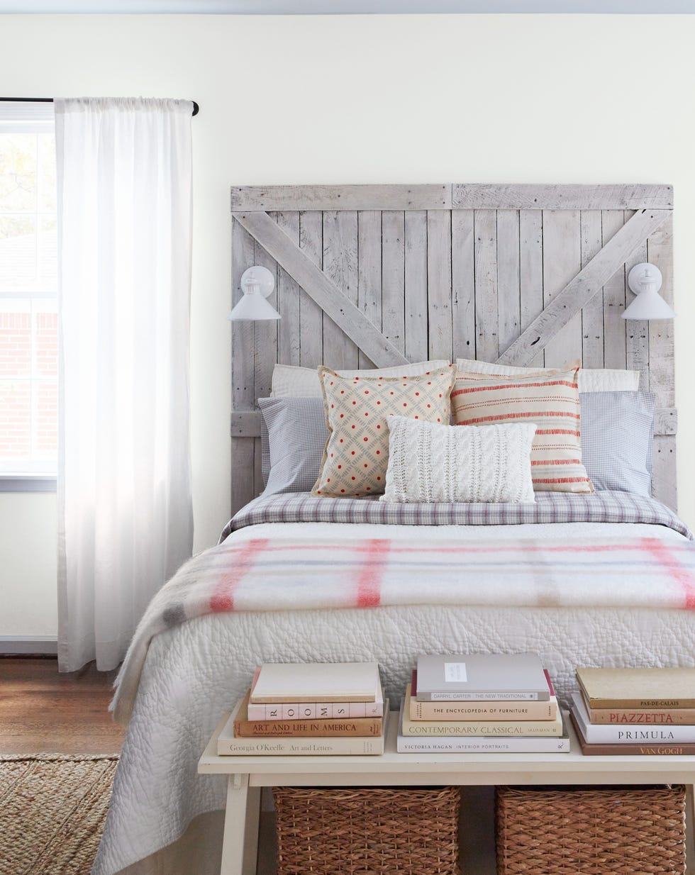 farmhouse style bedroom with headboard made from pair of barn doors