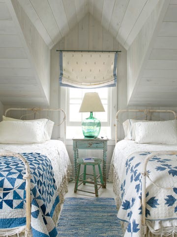 sunny bedroom with antique twin white wrought iron beds