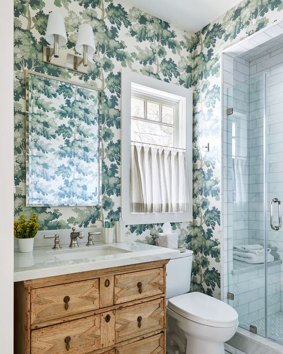 bathroom with green botanical wallpaper