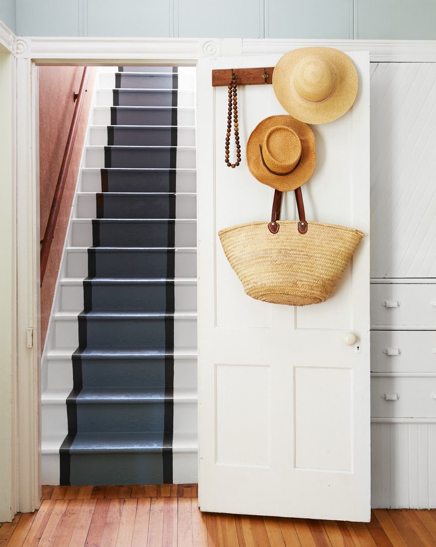 white stairs with painted runner