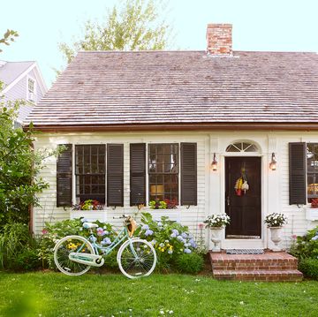 cape cod cottage with blue bike out front