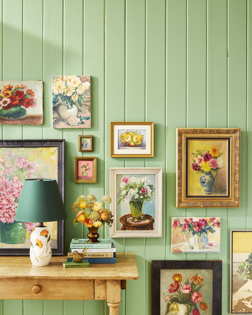 wall of vintage floral paintings