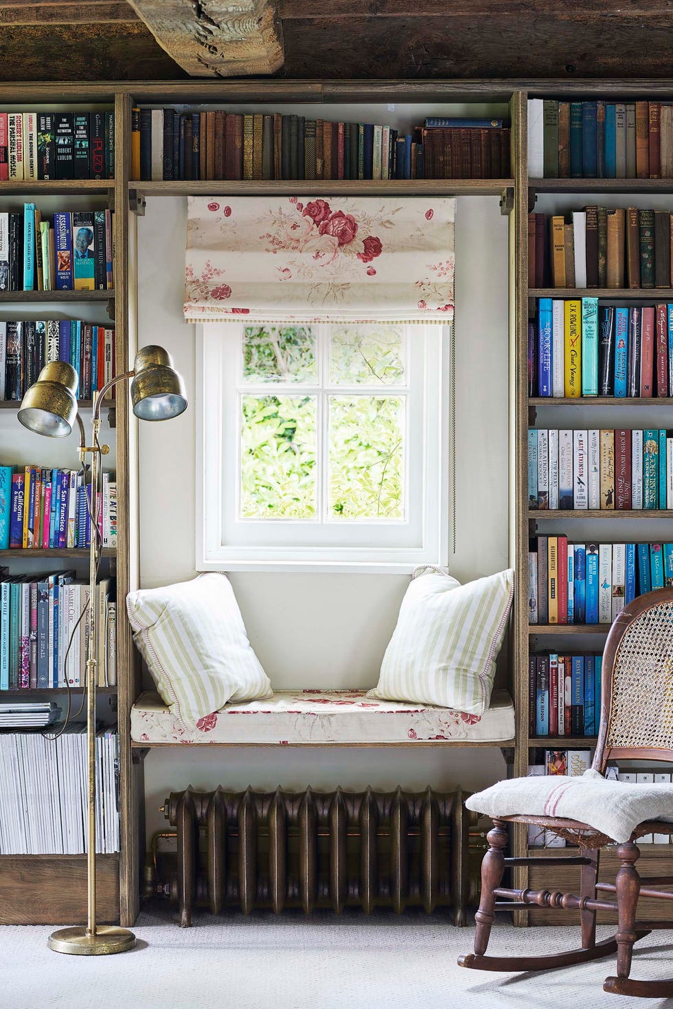 window seat in a reading nook in a countryside cottage