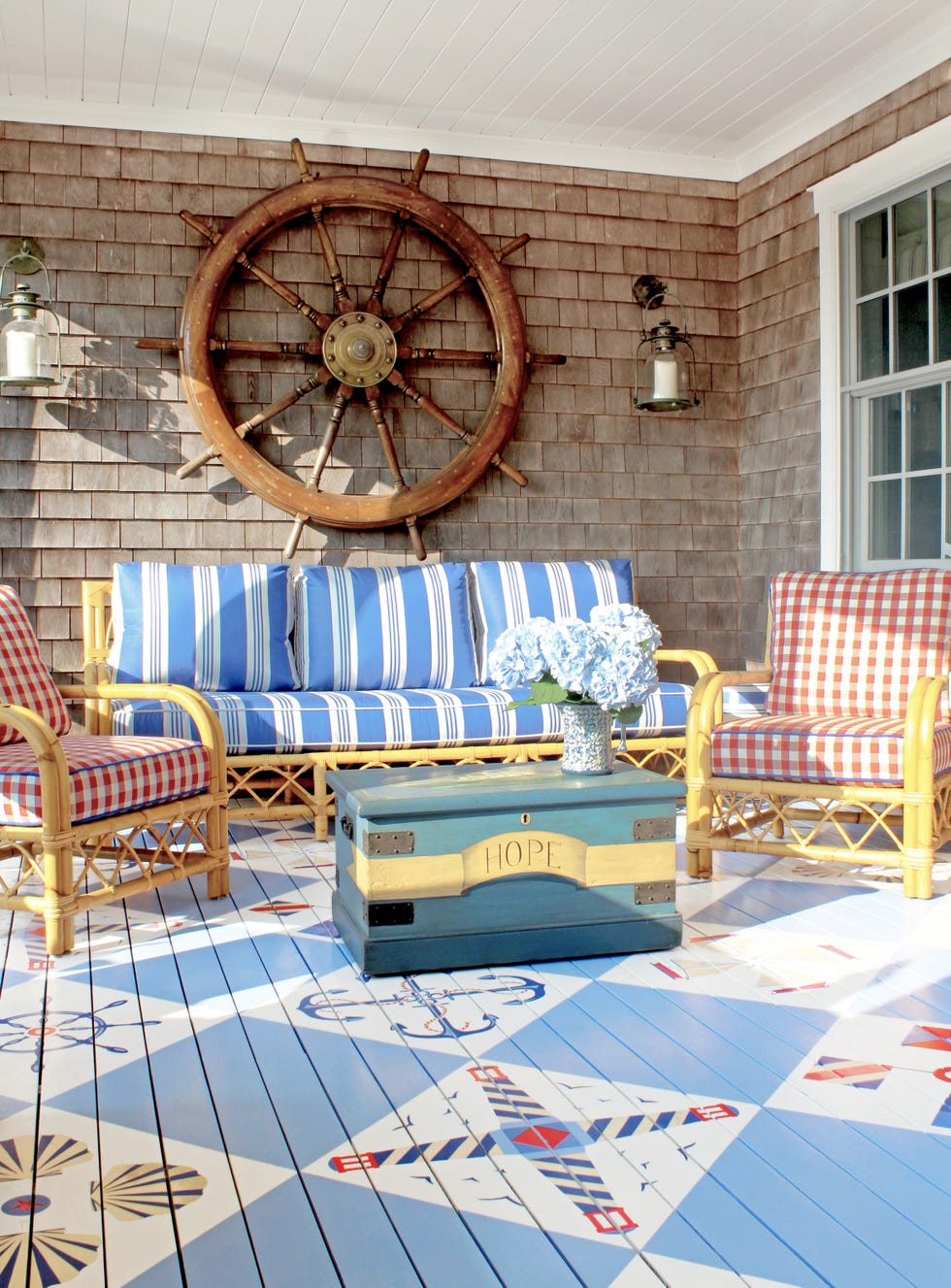 nautical porch designed by anthony baratta with a painted floor in a nautical theme