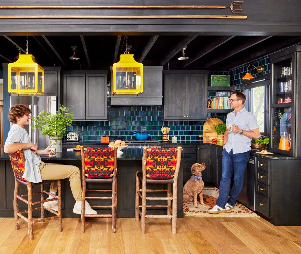 black kitchen with patterned bar stools