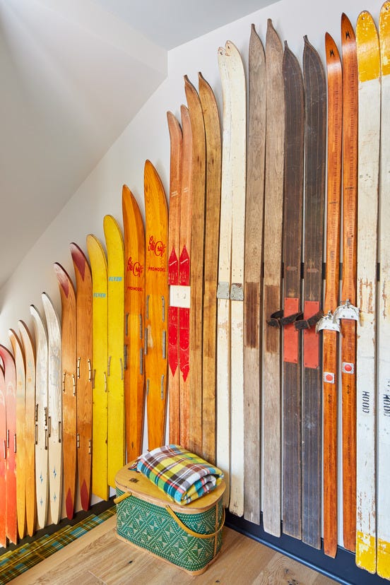 stairwell wall lined with vintage waterskis
