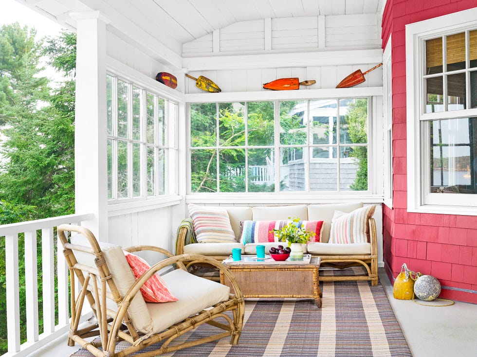 a coastal porch with rattan furniture