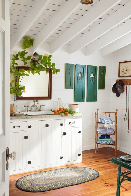 white summer cabin bathroom with exposed beams