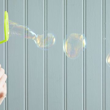 bubble wand blowing bubbles