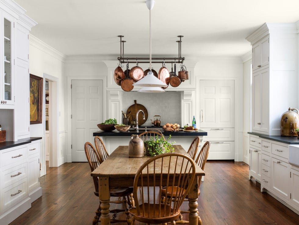 white kitchen with rustic wood dining room table