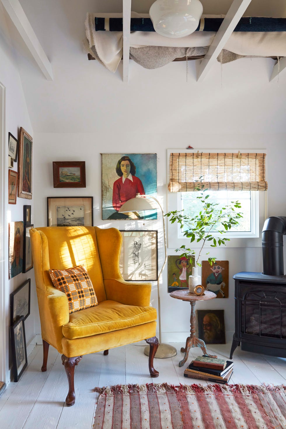 yellow wingback chair in corner of home