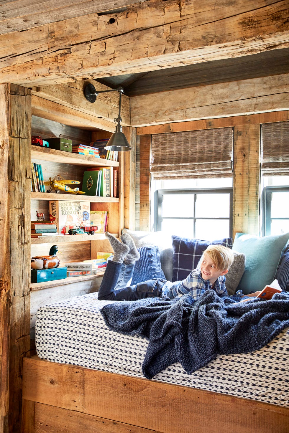 a tucked away reading nook made of reclaimed wood