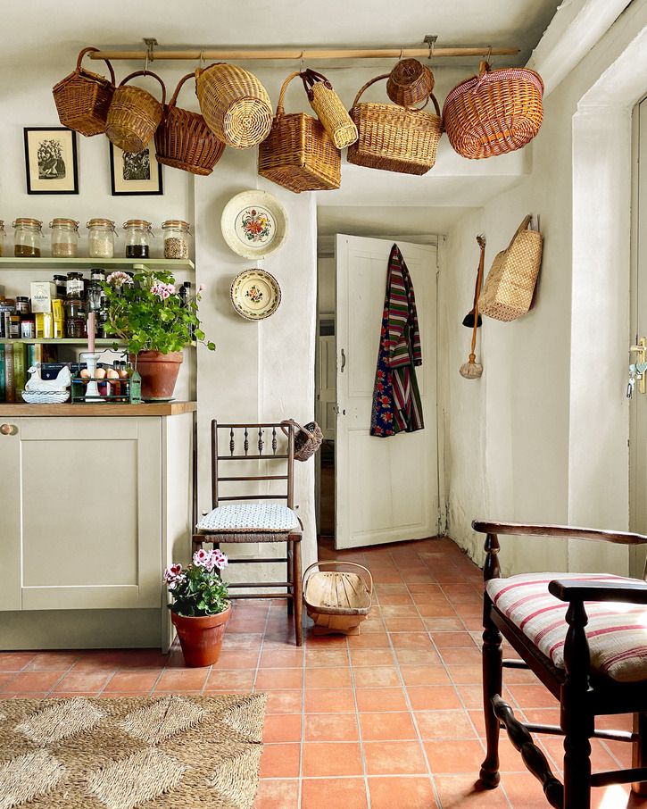 kitchen with basket collection, tile floor, open shelves, white cabinets