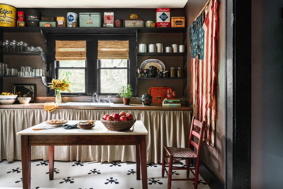 kitchen with long skirted cabinet and island made out of a repurposed table