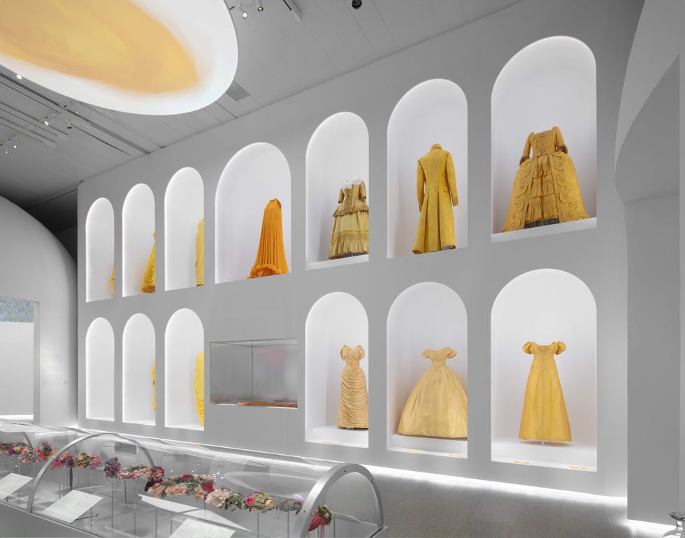 a wall with dresses on it a wall with dresses on it