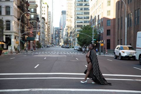 selfportrait of nona faustine walking in white heels on a new york street