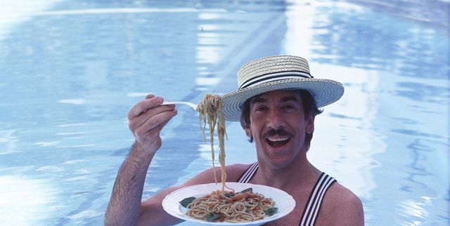 Marco Columbro eating pasta into a pool