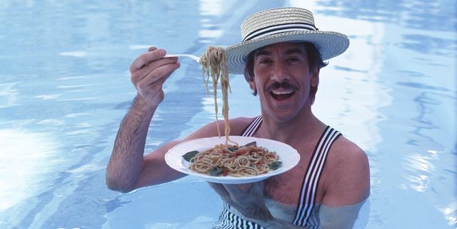 Marco Columbro eating pasta into a pool