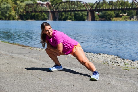 a runner stretching after a run