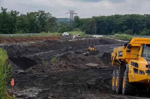 DUMFRIES, VA - JUNE 26: Heavy machinery excavate and carry
