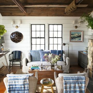 cozy, coastal living room with blue and white textiles