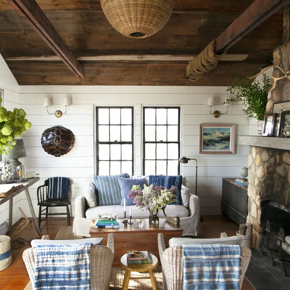 cozy, coastal living room with blue and white textiles