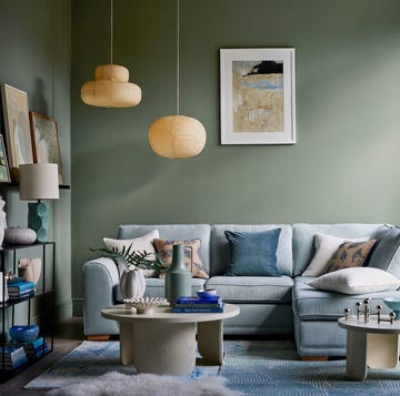 a living room with a couch and a table a living room with a couch and a table