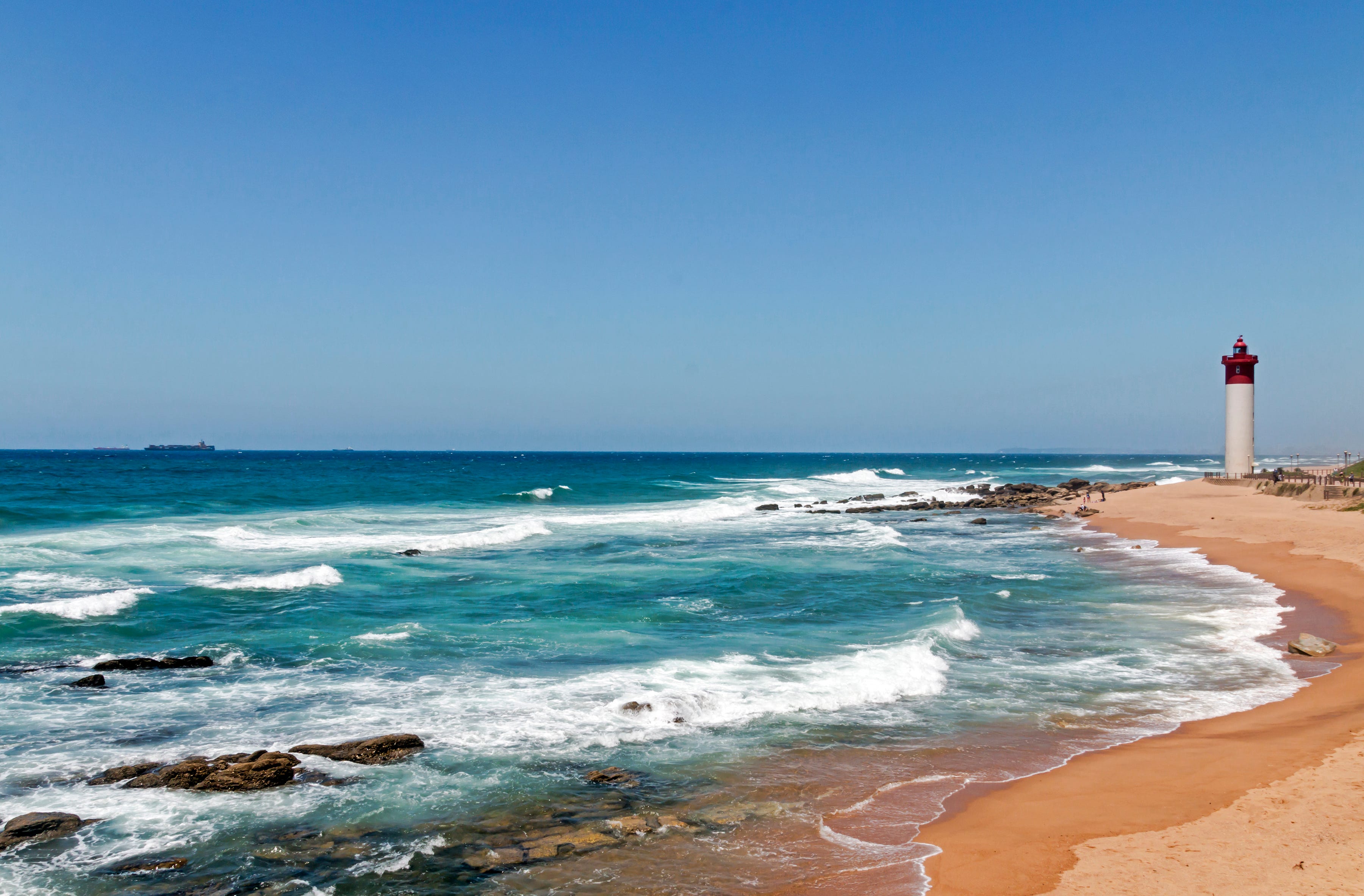 Coastal Seascape with Red and White Lighthouse Blue Sky