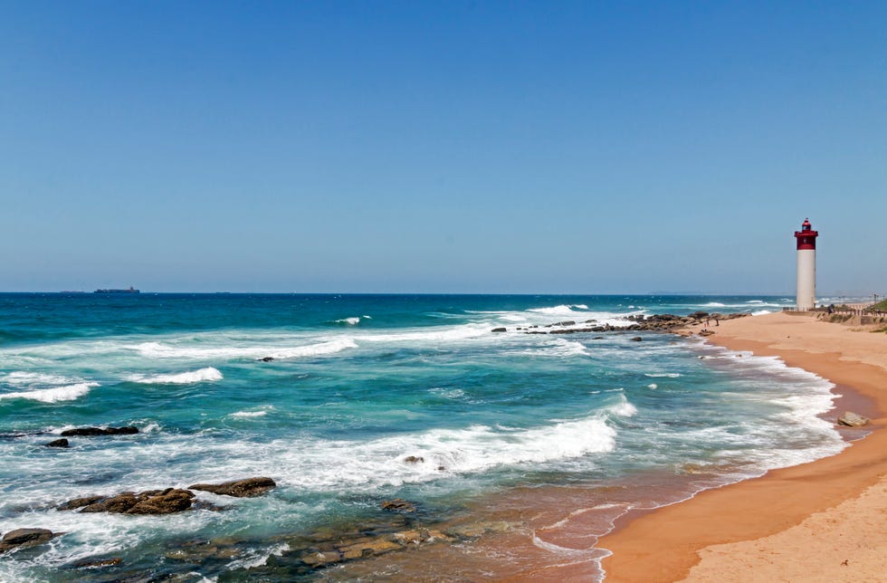Coastal Seascape with Red and White Lighthouse Blue Sky