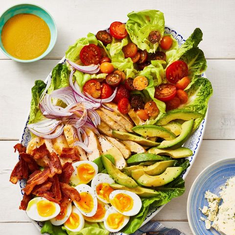 cobb salad with avocado, bacon, red onion and soft boiled eggs