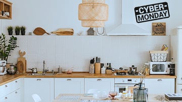 scandinavian style cozy modern kitchen interior with a dining zone, white modern interior, everyday still llife, stay at home coronavirus quarantine, chores