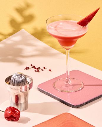 pink margarita in a martini glass