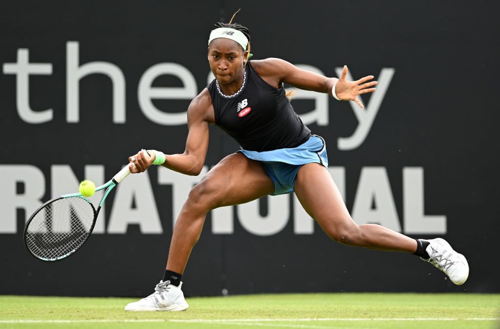 coco gauff lunging with her racket to hit a tennis ball