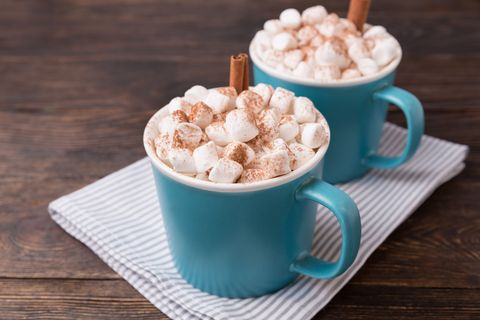 cocoa with marshmallows on brown wooden background