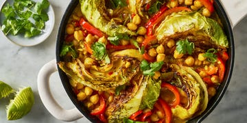 coconut braised cabbage with peppers and chickpeas in a skillet