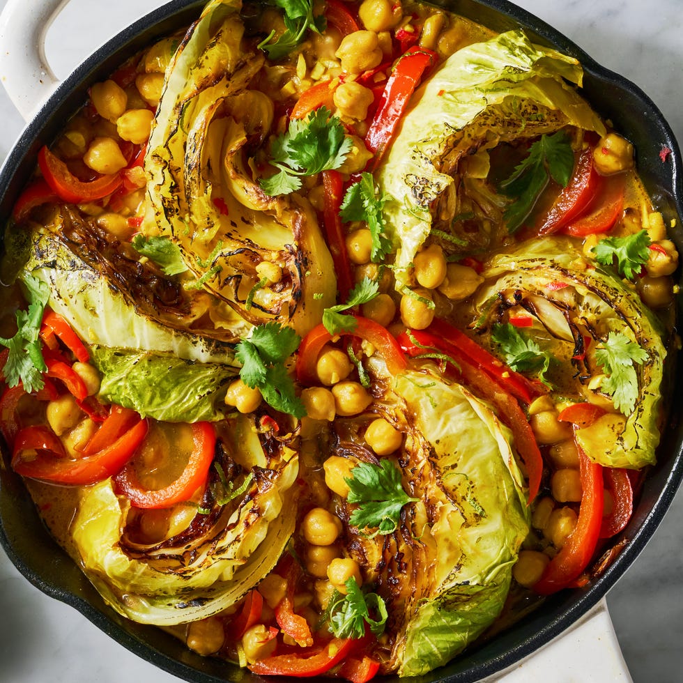 coconut braised cabbage with peppers and chickpeas in a skillet