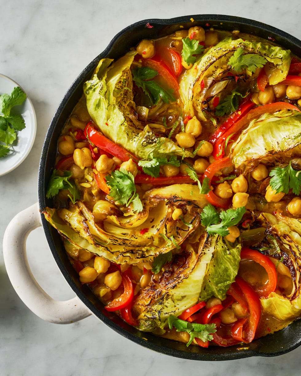 coconut braised cabbage with peppers and chickpeas in a skillet