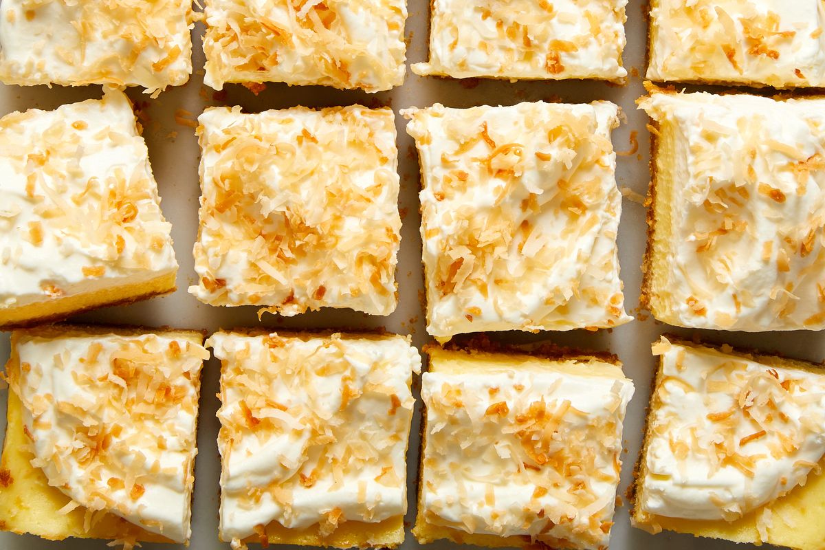 coconut cheesecake bars with coconut on top