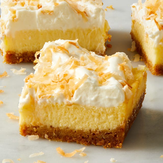 coconut cheesecake bars with coconut on top