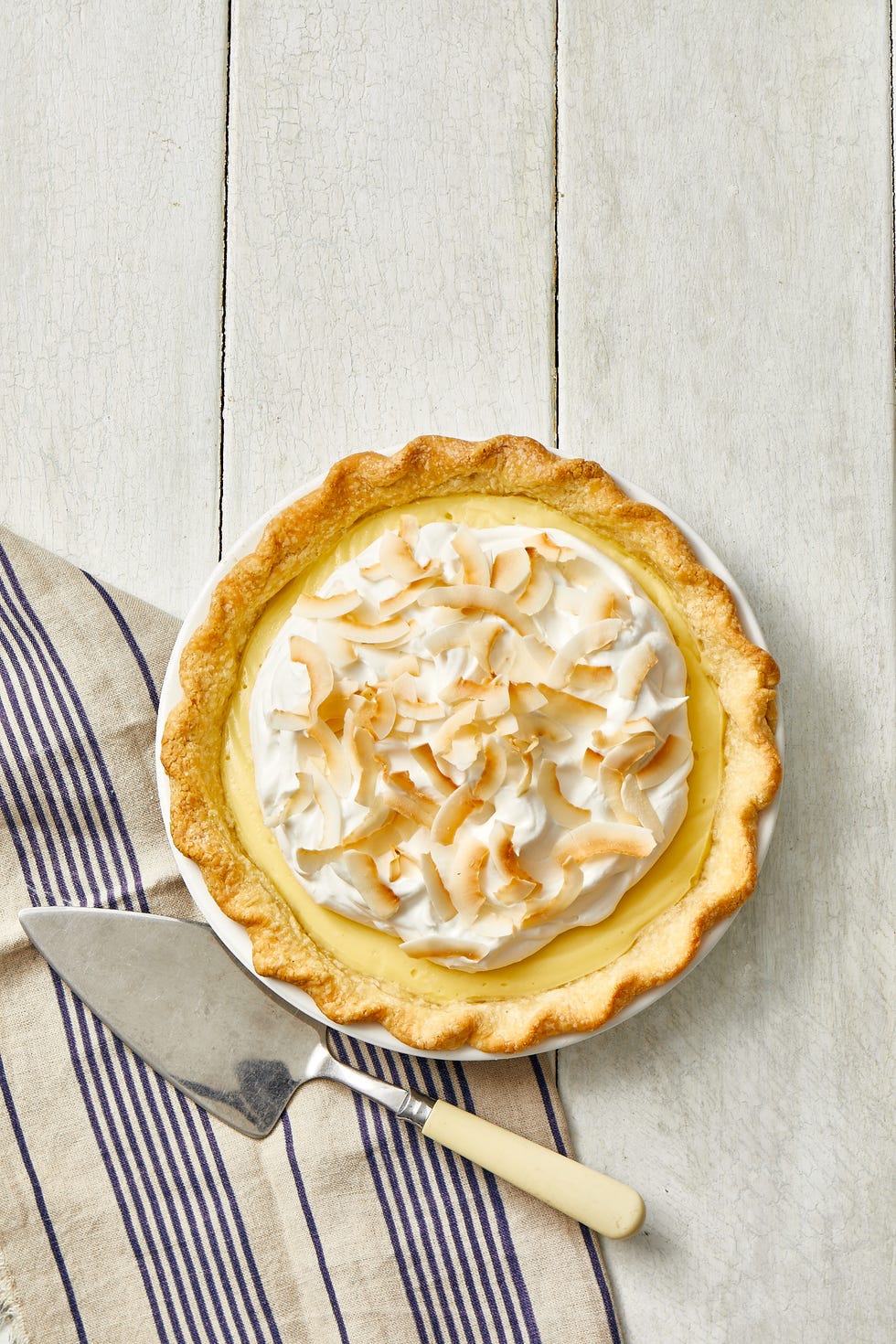 coconut cream pie with coconut shavings on top