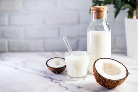 coconut drink in bottle on white marble table